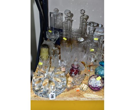 A GROUP OF COLOURED GLASS AND CUT CRYSTAL DECANTERS, comprising a Stuart Crystal 'Cascade' pattern bud vase, a Wedgwood Trent