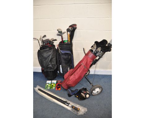 A COLLECTION OF GOLFING EQUIPMENT to include a Donnay manual caddy/cart, three golf bags containing incomplete sets and addit