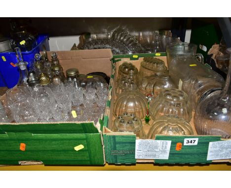 THREE BOXES OF GLASSWARES, to include nine clear glass jelly moulds, pressed glass fruit bowls, a lamp work cockerel and dog,