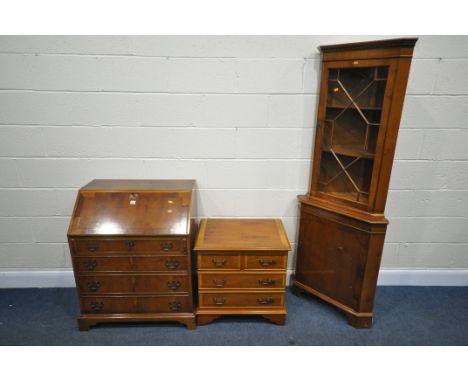 A QUANTITY OF YEWWOOD, to include a fall front bureau, corner cupboard and a cd cabinet (condition:-good condition) (3)