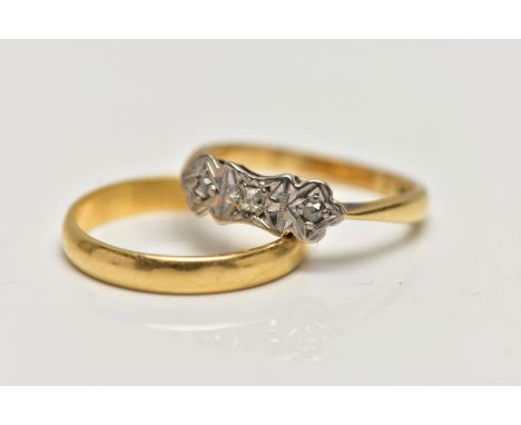 AN 18CT GOLD BAND RING AND A YELLOW METAL THREE STONE DIAMOND RING, the plain polished band, hallmarked 18ct London ring size