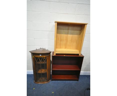 A MAHOGANY SINGLE DOOR HANGING CORNER CUPBOARD (one key) and two open bookcases (condition:-missing some shelf pins) (3)