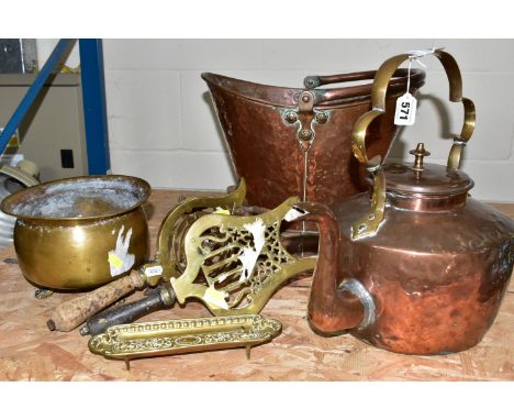 A GROUP OF COPPER AND BRASSWARES, comprising a large copper coal bucket, copper kettle with a brass handle, brass planter sup