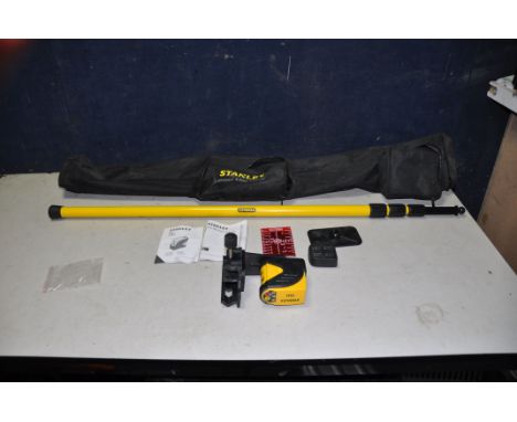 A STANLEY CLLi CROSS LINE LEVEL with pole, magnetic and pole attachments, manual and case