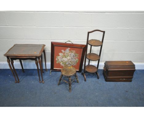 A MAHOGANY FOLDING CAKE STAND, a vintage sewing machine, a circular seated stool, fire screen (missing one foot) and a nest o