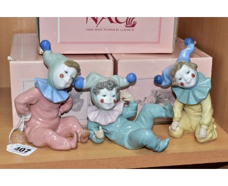 THREE BOXED NAO PORCELAIN FIGURINES, comprising Joy no 1067, Jangles no 1066 (chip to right elbow, firing fault to palm of le