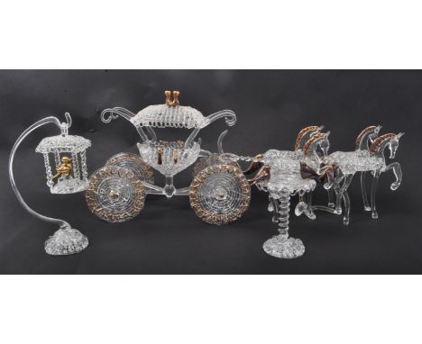 A 20th century studio art glass sculpture of a horse and carriage. The 4-horse drawn carriage with other art glass items incl