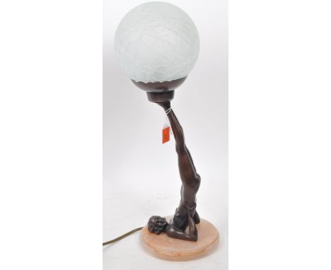 A 20th century Art Deco style desk table lamp. The lamp having a spherical crackle effect glass shade, raised over bronzed da