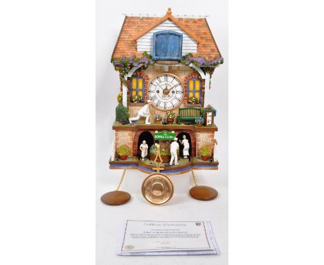 The Bradford Exchange - A 21st-century 'The Spirit of The Bowls' cuckoo clock. The clock is crafted in the shape of a bowls c