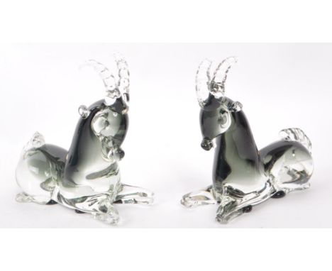 A pair of mid-century Italian murano-style glass antelope sculptures, in a smoky blue colour. Each measuring approx. 16cm tal