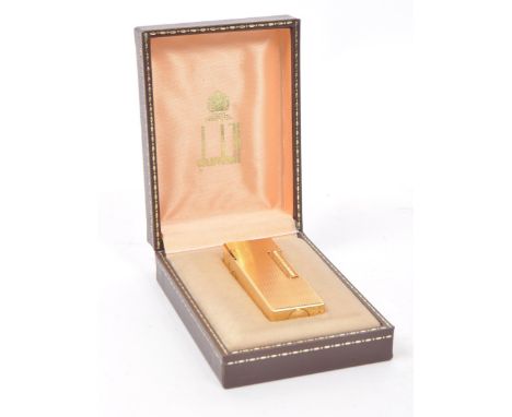 Dunhill - A vintage 20th century Dunhill Rollagas rolled gold plated lighter. The lighter having engine turned crosshatched d