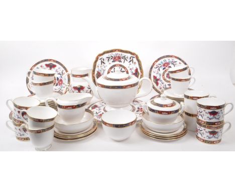 Royal Worcester - Prince Regent - A collection of 1994 tea service pieces, including a teapot, cups, saucers, dinner plates, 