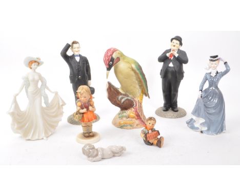 A collection of eight 20th-century ornaments and figurines, comprising of a Beswick 1218 'Woodpecker', The Leonardo Collectio
