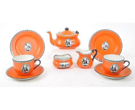 Carlton Ware - A collection of early 20th-century porcelain tea service pieces, including a teapot, two cups, two saucers, a 