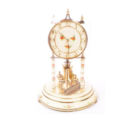A vintage mid century 1950s West-German Kundo anniversary clock. Raised on a tin base, with gilt metal frame, pink floral dec