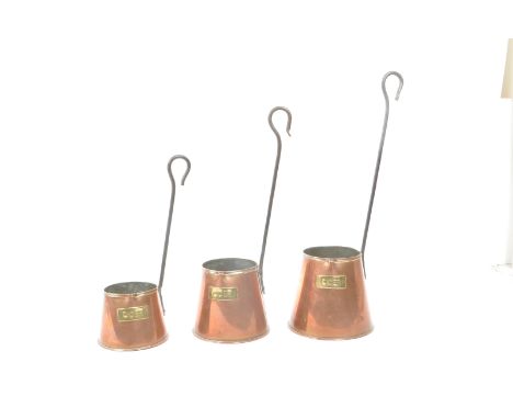Set of three copper cider measures graduating in size, each with a long hook handle and brass plaque. Vintage, made in Englan