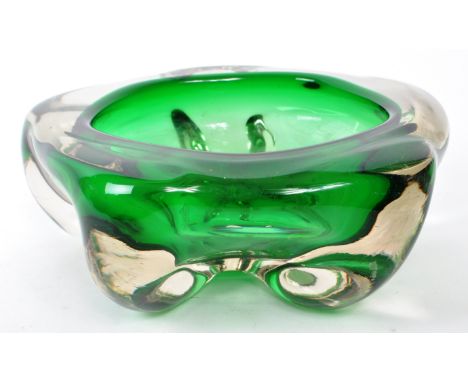 A vintage 20th-century studio glass green centerpiece bowl, art deco style. Featuring five bulbous feet and a thick body to t