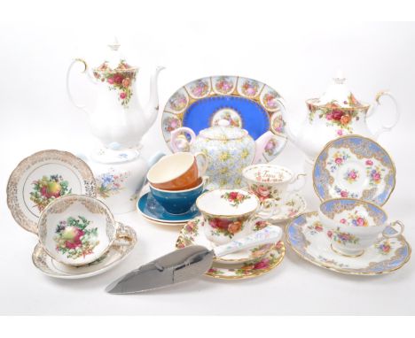 A collection of vintage 20th-century fine bone china teapots, cups, and saucers. To include: Paragon, Royal Albert, Susie Coo