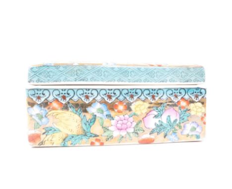 A vintage 20th century Chinese porcelain lidded box. With hand-coloured flowers, gilt decorated background, and a blue border