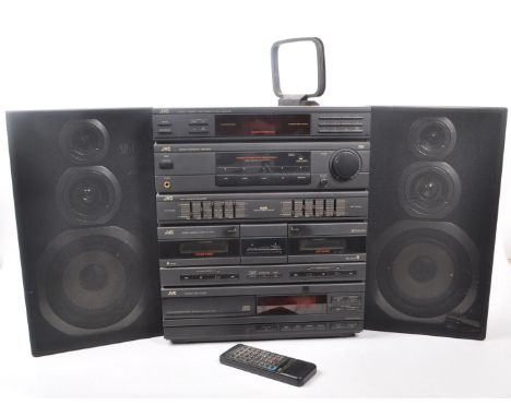 JVC - A vintage late 20th century stacking stereo system and two speakers. Featuring hi-fio audio visual equipment such as a 