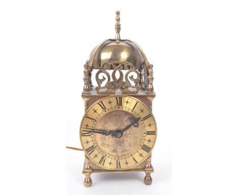 Smiths - A mid century electric brass Smiths lantern clock. Domed top with gilt face and ebonised Roman numerals / chapter ri