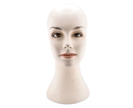 An Art Deco shop display mannequin female head bust. Plaster construction with Deco style smokey eye make up and lipstick.