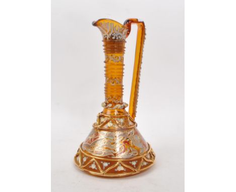 A vintage 20th century amber glass ewer, with geometric and swirling gilt decoration, including hand-painted flowers and natu