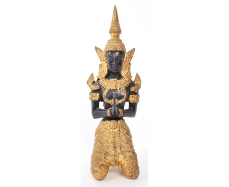 A vintage 20th-century stone carved Thai Teppanom temple Buddha figure, with clothes painted with gilt decoration. The figure