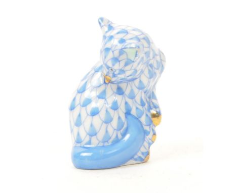 Herend - A vintage 20th century Herend miniature porcelain cat figure. The figure in the form of a sitting cat, with blue fis