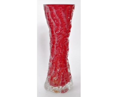 A vintage 20th-century Whitefriars style red / maroon vase. It features a concave shape and bark effect on the glass. Measuri