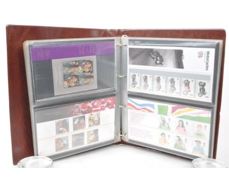 A collection of 21st-century British Royal Mail stamp presentation packs. The collection includes examples such as 'Classic L