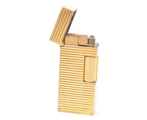 Dunhill - A vintage 20th century Dunhill Rollagas miniature gold plated lighter. The lighter having gold plated body, featuri
