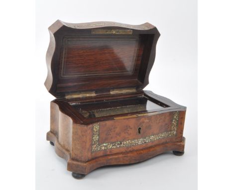 A 19th century walnut musical box inlaid with mother of pearl. Cylinder type mechanics, comb fully intact and in working orde