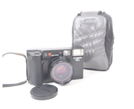 A vintage 1980s Canon AF35ML 35mm compact point-and-shoot camera. Including lens cap and camera case. Measuring approx. 7cm x