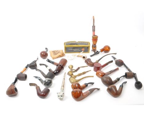 A large collection of 20th century tobacco pipes. The collection featuring briar, wooden, ceramic, and brass examples, with m