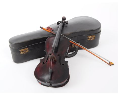 An early 20th century apprentice violin, measuring approx 24cm long. Comprising of the violin, bow and red lined case, with l