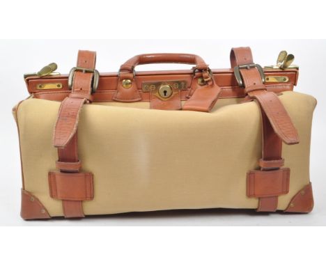 Swaine Adeney Brigg - A vintage 20th century Swaine Adeney Brigg canvas and leather large coach / gladstone bag. The bag havi