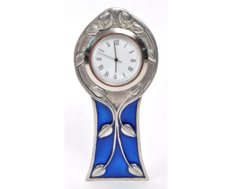 A E Williams - An English early 20th-century arts and crafts table / mantel clock, featuring a pewter and blue enameled body,