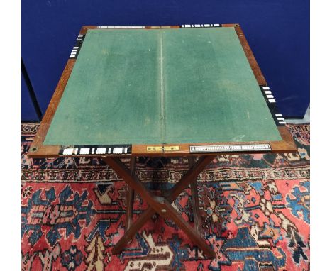 Edwardian campaignstyle mahogany folding card table, with baize playing surface and inset ivory markers, 67cm x 68½cm, 72cm. 