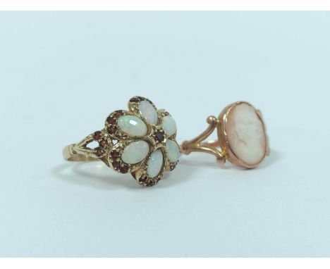 Opal and garnet ring in 9ct gold, and another coral, 9ct gold, 6.8g.  (2)Condition report: Both garnet & opal ring good - cam