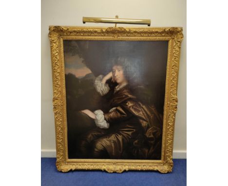 Circle of Sir Peter Lely (1618-1680) Portrait of a Fashionable Young Gentleman seated in three quarter length, wearing brown 