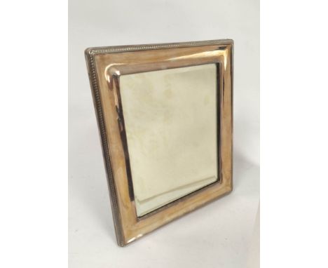 Rectangular easel mirror with beaded silver mount, by Walker & Hall, Birmingham, 1921, 33cm x 28cm. Condition report: Very go