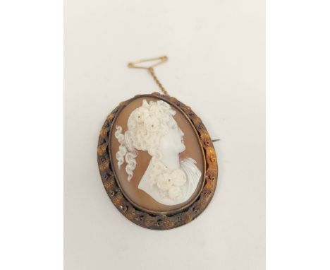 Victorian shell cameo brooch, with portrait of woman in high relief, the gold mount with matted leafage, possibly 9ct gold. 