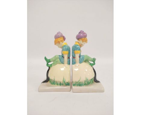 Pair of Clarice Cliff Wilkinson &amp; Co bookends in the form of pixies with otters sitting on toadstools. 