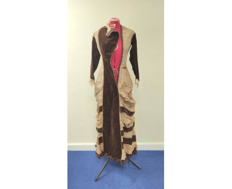 Late Victorian lady's dress, in brown velvet and cafe au lait spotted silk, with tiered ruched skirt, bustle back with bow an