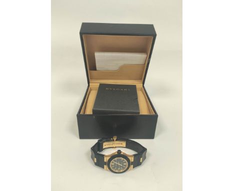 Bulgari AL32 automatic watch, 18ct gold and butyl, with receipt and other items, in box.