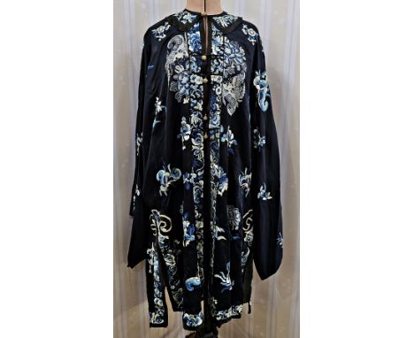 Chinese silk embroidered robe early 20th century, embroidered with flowers and butterflies in blue, loop and button fastening