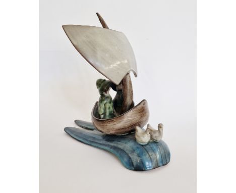 Tessa Fuchs (1936-2012) earthenware model of two figures in sailing boat on waves, impressed mark to front of boat 'TF', 28cm