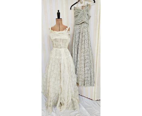 A 1950's grey lace strapless evening dress, ruched bodice, the lace overlaid, a pale pink satin and grey net under dress, sid