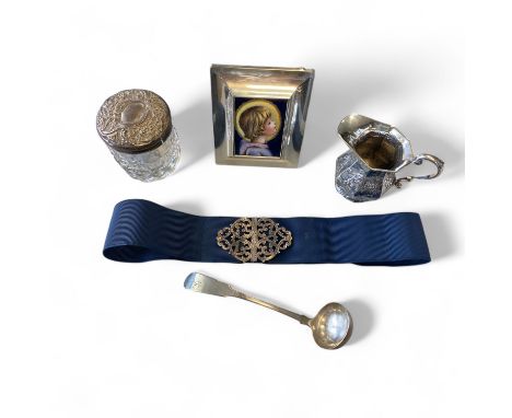 A group of silver and a plated nurses buckle- comprising a Dutch 930 silver embossed cream jug import mark Alfred Lewis Londo
